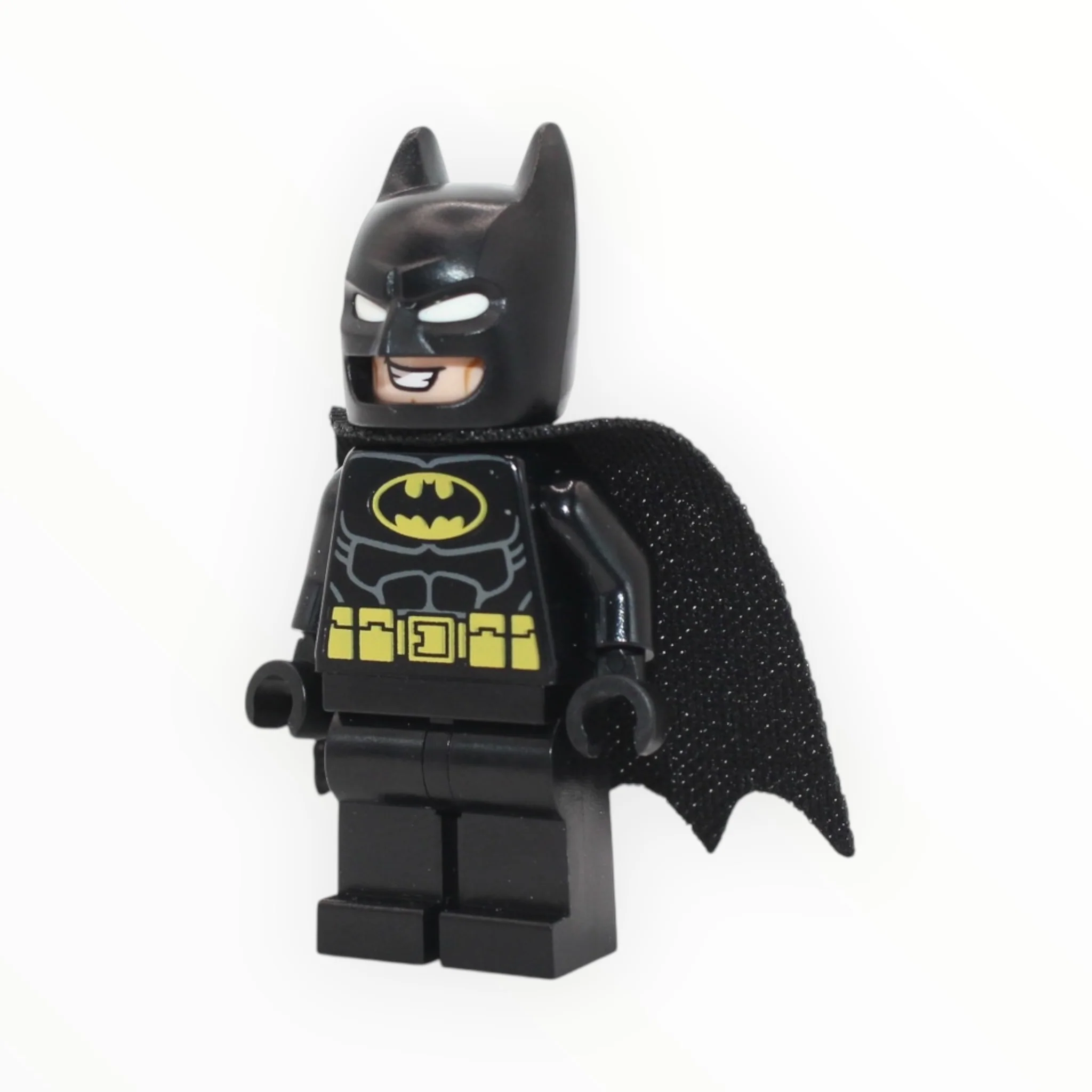 Batman (molded white eyes, black suit, large grin, one-hole cape, 2023)