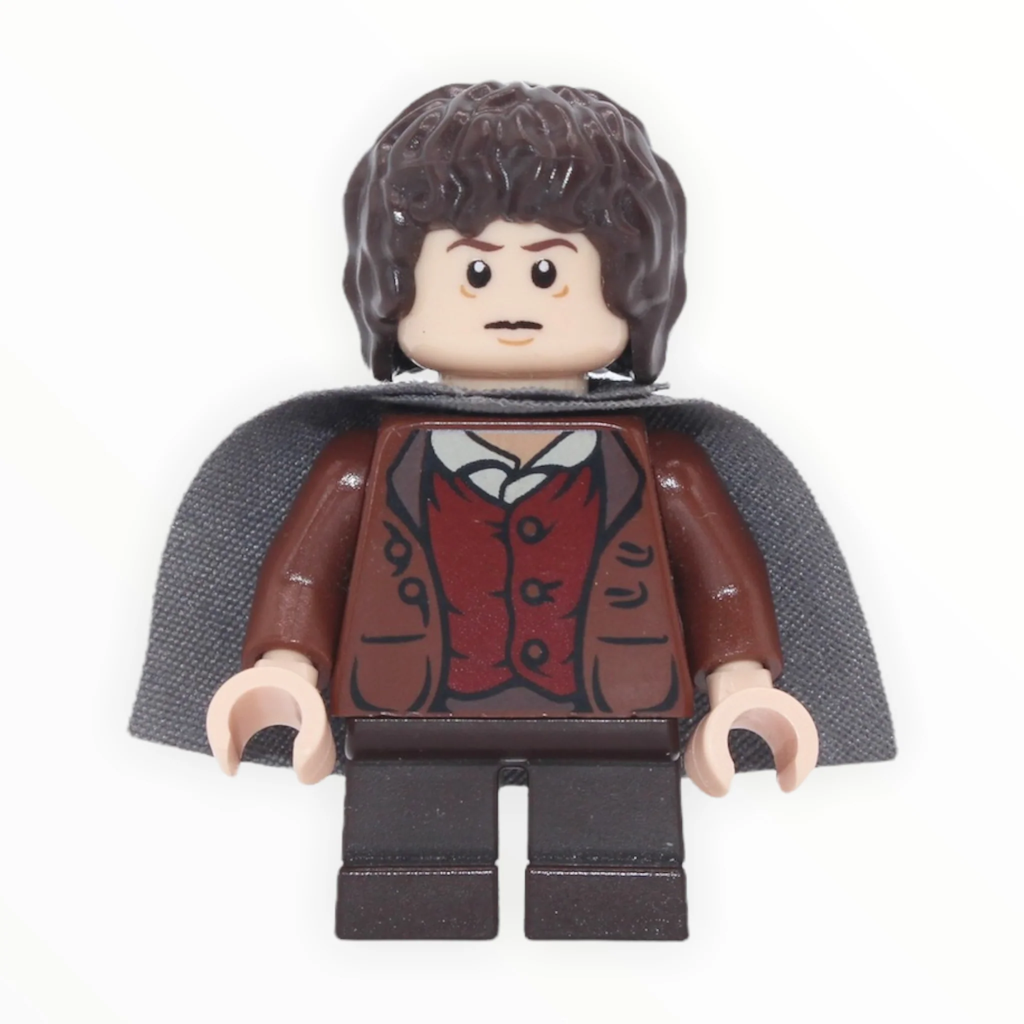 Frodo Baggins (reddish brown jacket, dark brown short legs, dark bluish gray cape, tired / poisoned)