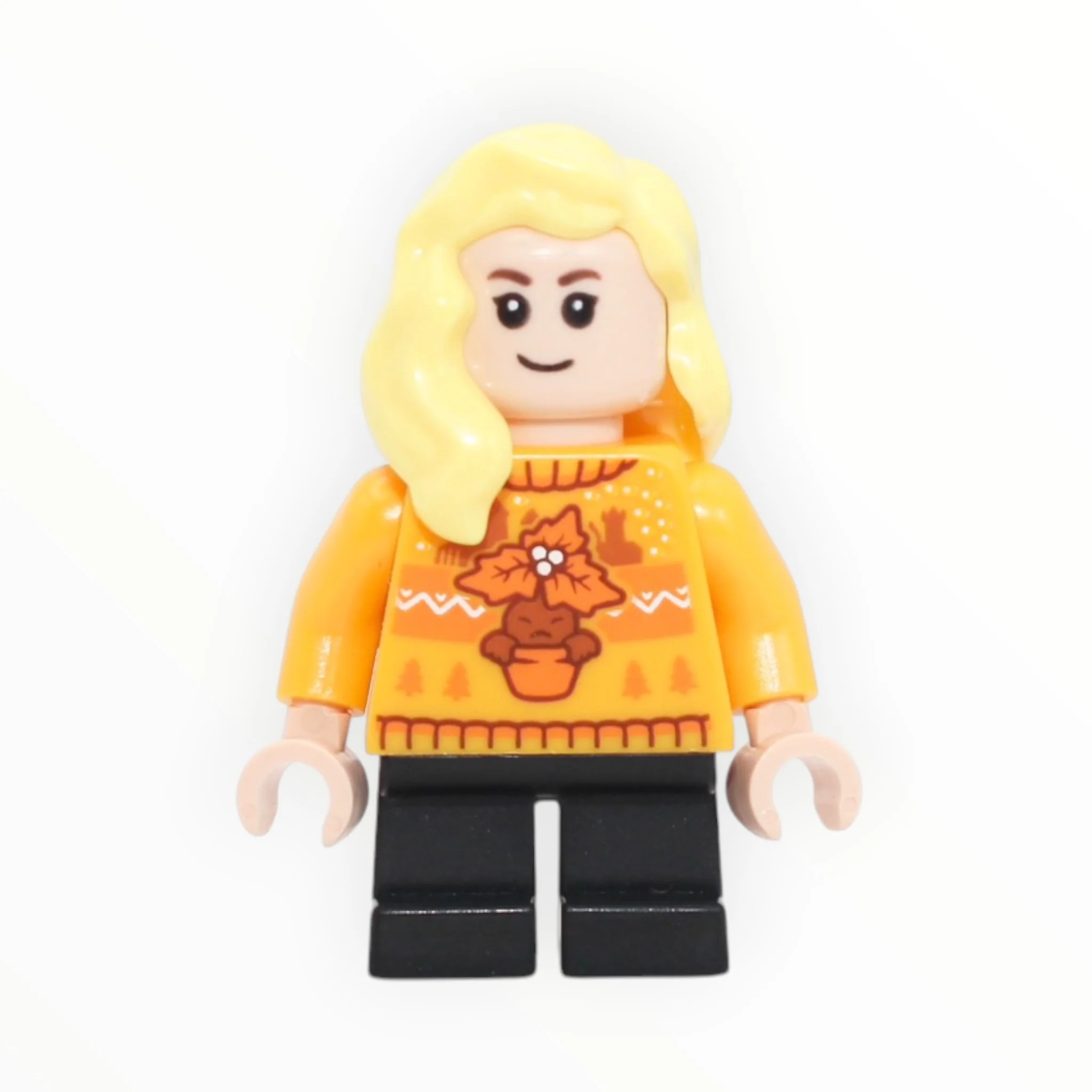 Hannah Abbott (bright light orange holiday sweater, short black legs, 2025)