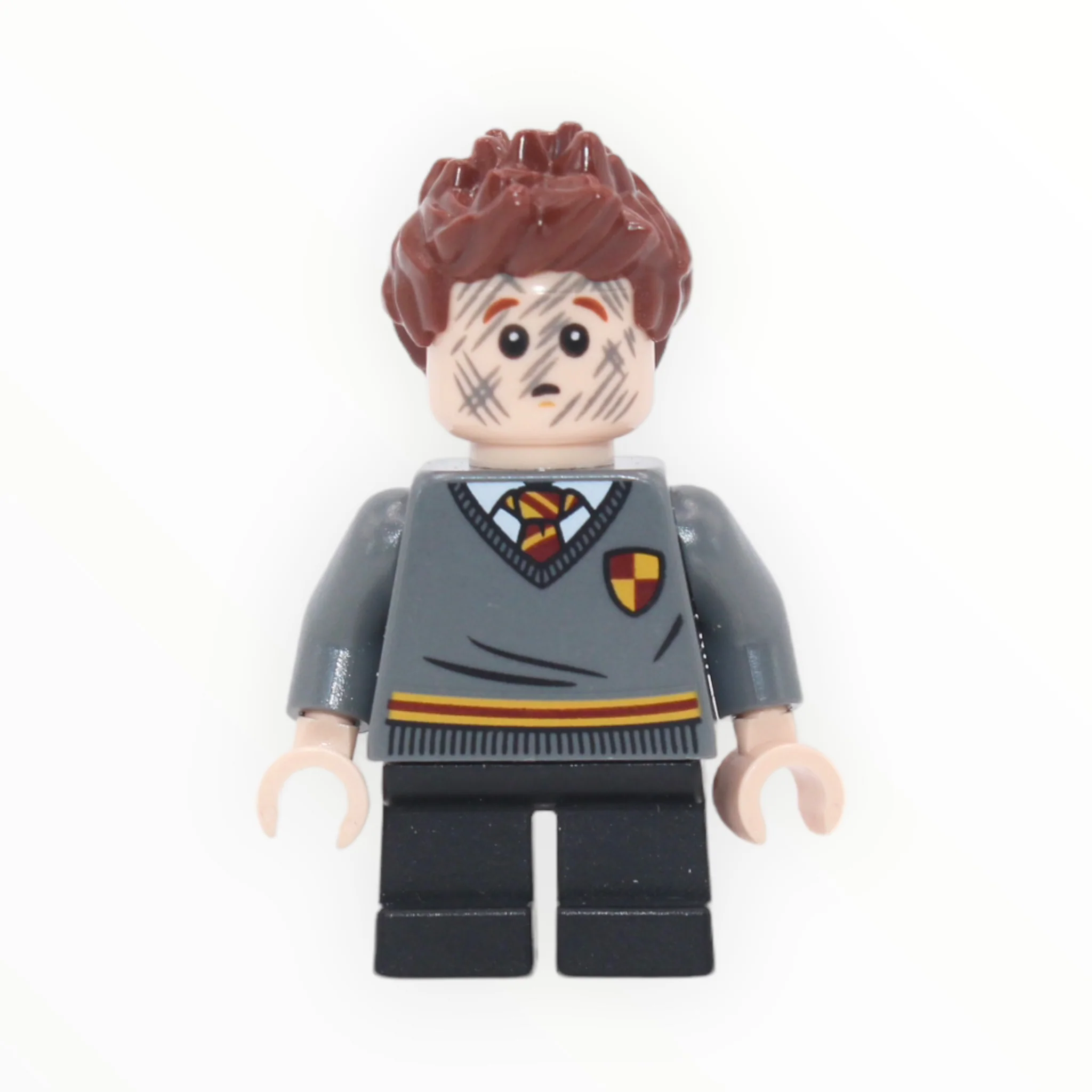 Seamus Finnigan (Gryffindor sweater with crest, dirty face, short legs)