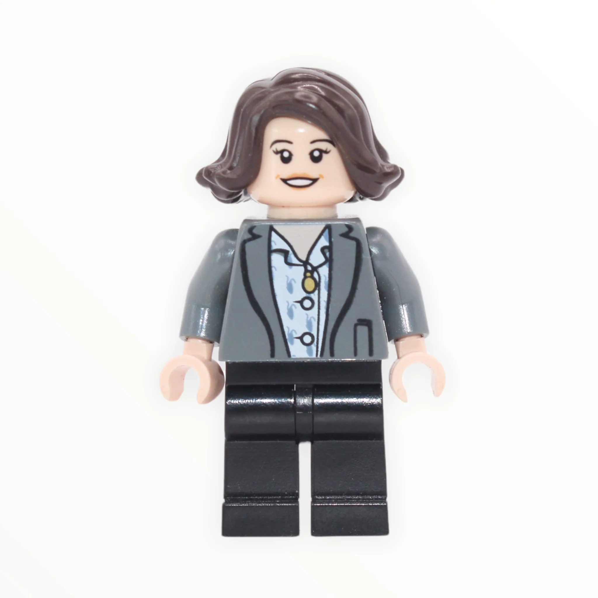 Tina Goldstein (hair, light bluish gray jacket, black legs)